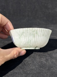 A Chinese jade 'chrysanthemum' bowl, an archer's ring and a belt hook, Ming/Qing