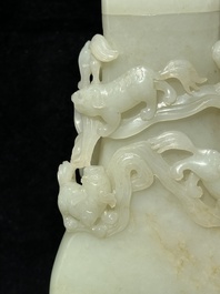 A fine Chinese white jade 'Buddhist lions' vase and cover, Qing