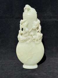 A fine Chinese white jade 'Buddhist lions' vase and cover, Qing