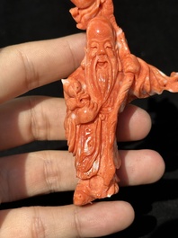 Two Chinese red coral figures of Shoulao on wooden stand, 19/20th C.
