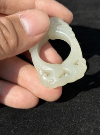 A Chinese white jade cup and two rings, Qing