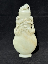 A fine Chinese white jade 'Buddhist lions' vase and cover, Qing