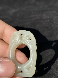 A Chinese white jade cup and two rings, Qing