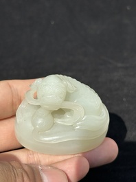 A fine Chinese white jade 'Buddhist lions' vase and cover, Qing