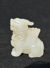 A Chinese white jade carving of a mythic animal, 19/20th C.