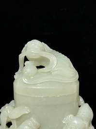 A fine Chinese white jade 'Buddhist lions' vase and cover, Qing