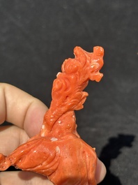 Two Chinese red coral figures of Shoulao on wooden stand, 19/20th C.