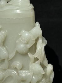 A fine Chinese white jade 'Buddhist lions' vase and cover, Qing