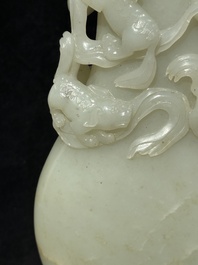 A fine Chinese white jade 'Buddhist lions' vase and cover, Qing