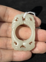 A Chinese white jade cup and two rings, Qing