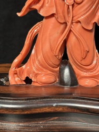 A Chinese red coral Xiwangmu on wooden stand, 19/20th C.