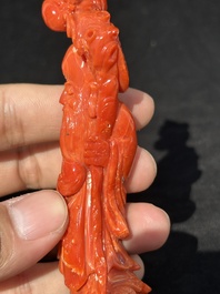 Two Chinese red coral figures of Shoulao on wooden stand, 19/20th C.