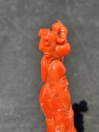 Two Chinese red coral figures of Shoulao on wooden stand, 19/20th C.