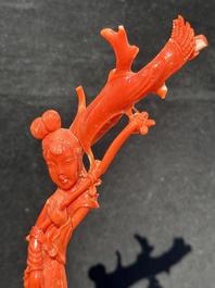 A Chinese carved red coral group with goddesses on wooden stand, 19/20th C.