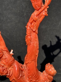 A Chinese carved red coral group with goddesses on wooden stand, 19/20th C.