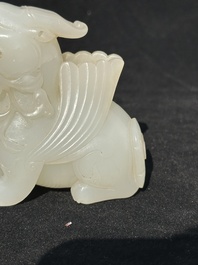 A Chinese white jade carving of a mythic animal, 19/20th C.