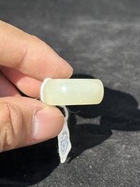 A Chinese white jade cup and two rings, Qing
