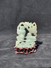 A Chinese jade 'He He Er Xian' group on wooden stand, 19th C.