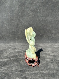 A Chinese jade 'He He Er Xian' group on wooden stand, 19th C.