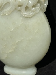 A fine Chinese white jade 'Buddhist lions' vase and cover, Qing