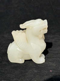 A Chinese white jade carving of a mythic animal, 19/20th C.