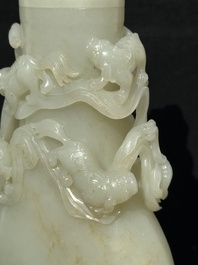 A fine Chinese white jade 'Buddhist lions' vase and cover, Qing