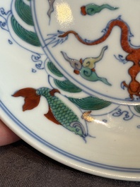 A Chinese doucai 'dragon and carps' plate, Chenghua mark, Yongzheng