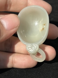 A Chinese white jade cup and two rings, Qing
