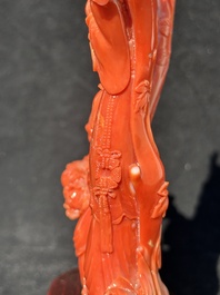 A Chinese carved red coral group with goddesses on wooden stand, 19/20th C.