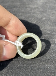 A Chinese white jade cup and two rings, Qing