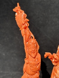 A Chinese red coral 'Sanxing' group on wooden stand, 19/20th C.