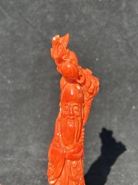 Two Chinese red coral figures of Shoulao on wooden stand, 19/20th C.
