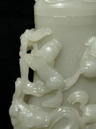 A fine Chinese white jade 'Buddhist lions' vase and cover, Qing