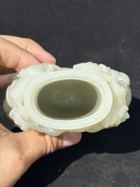 A fine Chinese white jade 'Buddhist lions' vase and cover, Qing