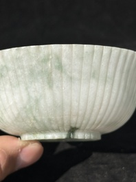 A Chinese jade 'chrysanthemum' bowl, an archer's ring and a belt hook, Ming/Qing