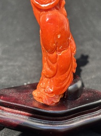 Two Chinese red coral figures of Shoulao on wooden stand, 19/20th C.