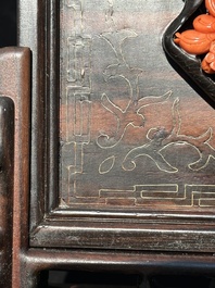 A Chinese silver-inlaid hardwood table screen with a red coral carving of a flower basket, 19/20th C.