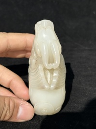 A Chinese white jade carving of a mythic animal, 19/20th C.