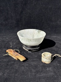 A Chinese jade 'chrysanthemum' bowl, an archer's ring and a belt hook, Ming/Qing