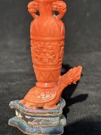 A Chinese carved red coral 'mythical animals' snuff bottle on stand, 19/20th C.