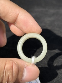 A Chinese white jade cup and two rings, Qing