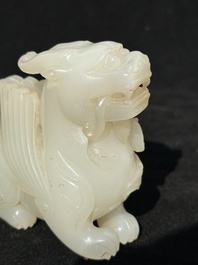 A Chinese white jade carving of a mythic animal, 19/20th C.