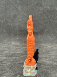 A Chinese carved red coral 'mythical animals' snuff bottle on stand, 19/20th C.