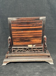 A Chinese silver-inlaid hardwood table screen with a red coral carving of a flower basket, 19/20th C.
