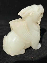 A Chinese white jade carving of a mythic animal, 19/20th C.