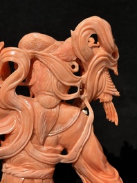 A Chinese red coral Xiwangmu on wooden stand, 19/20th C.