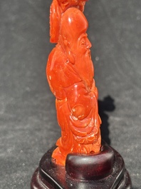 Two Chinese red coral figures of Shoulao on wooden stand, 19/20th C.