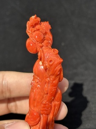 Two Chinese red coral figures of Shoulao on wooden stand, 19/20th C.