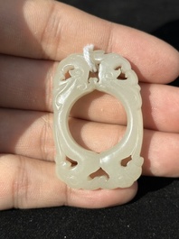 A Chinese white jade cup and two rings, Qing