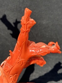 A Chinese carved red coral group with goddesses on wooden stand, 19/20th C.